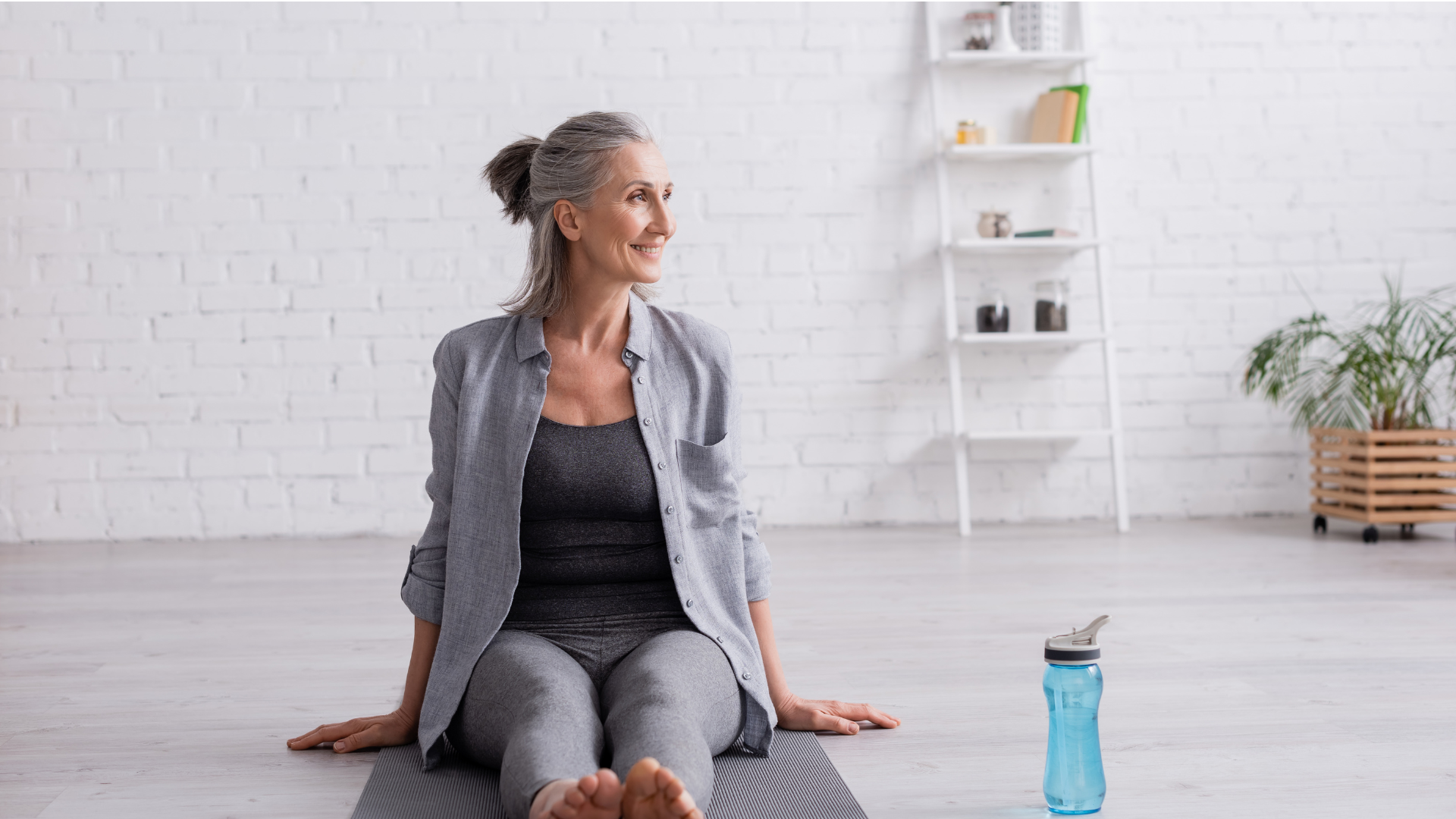 Senior woman practicing yoga at home to increase strength and flexibility and decrease muscle imbalances.