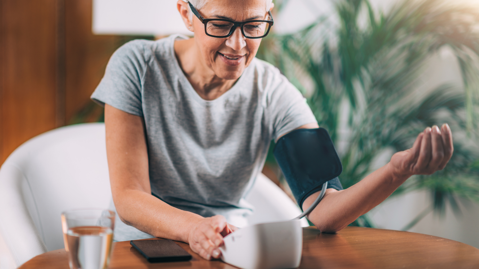 Senior Woman Measuring Blood Pressure at home