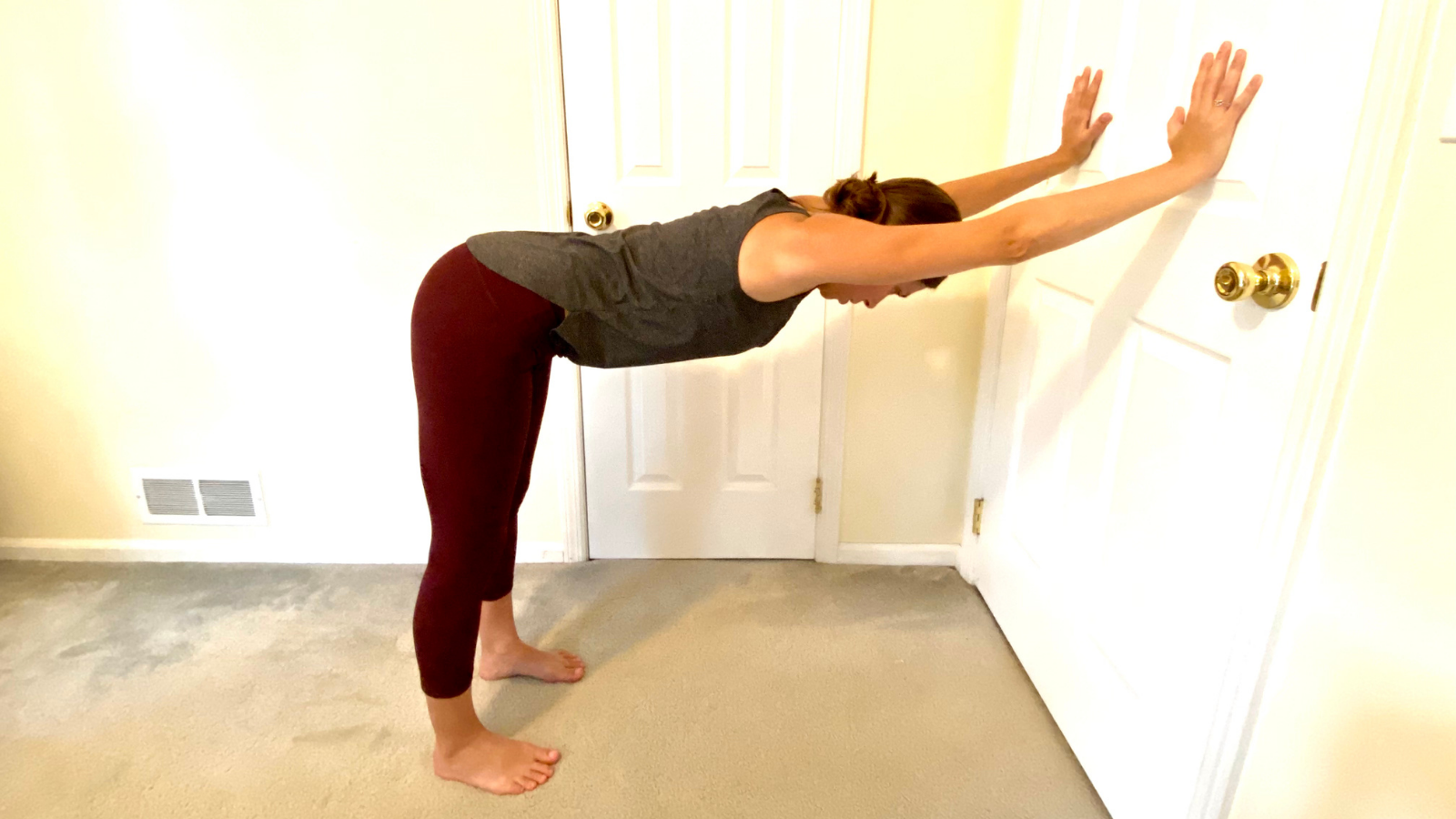 Gentle way to practice Downward Facing Dog Pose or Adho Mukha Svanasana at the wall